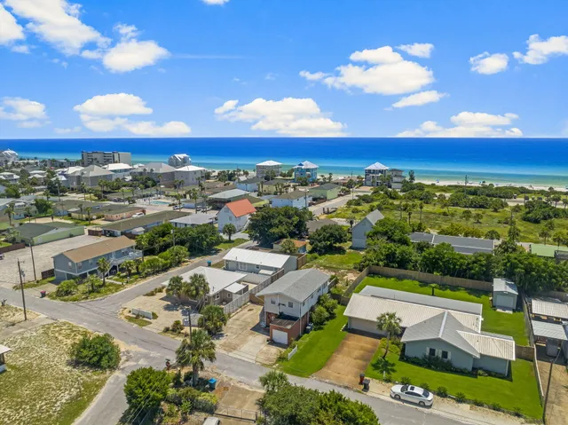 an aerial view of a house with outdoor space