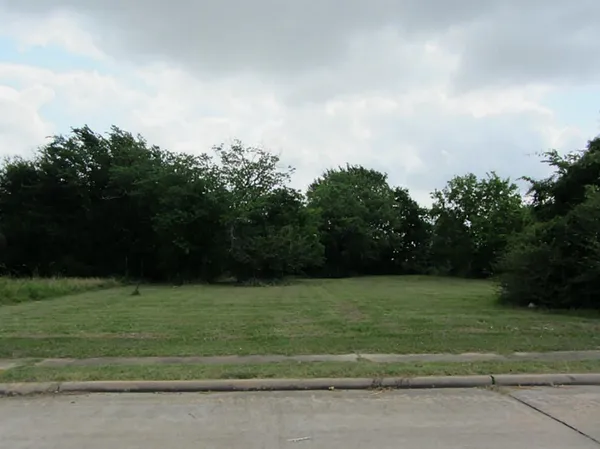 a view of a golf course with a lake