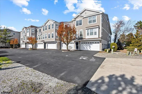 a view of a backyard with sitting area