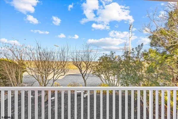 a bathroom with a bathtub a sink and a mirror
