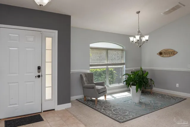a view of a livingroom with furniture and window
