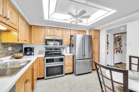 a bedroom with a bed and a lamp