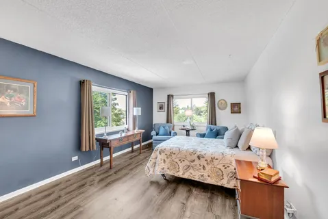 a bedroom with furniture and window