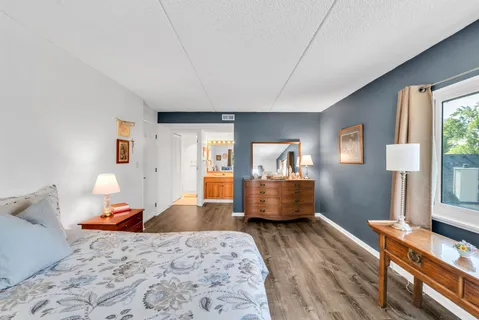 a bathroom with a sink mirror and a bathtub
