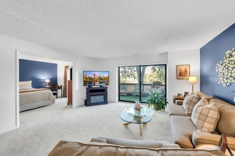 a kitchen with a refrigerator and a stove top oven