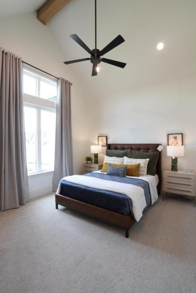4101 149th Street Lubbock, TX 79423 - Photo 42 of 53 a spacious bedroom with a bed and a chandelier