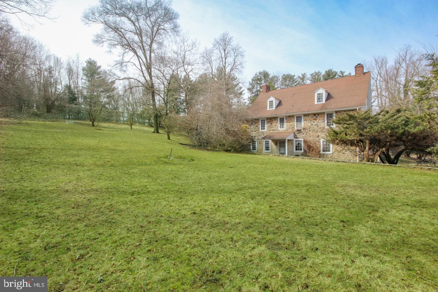 432 Old Forge Road Media, PA 19063 - Photo 2 of 41 a view of a big house with a big yard and large trees