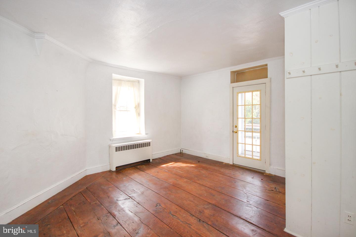 432 Old Forge Road Media, PA 19063 - Photo 14 of 41 an empty room with wooden floor and windows
