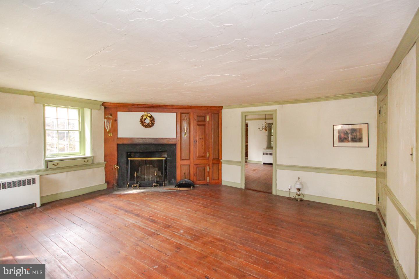 432 Old Forge Road Media, PA 19063 - Photo 3 of 41 an empty room with windows and fireplace