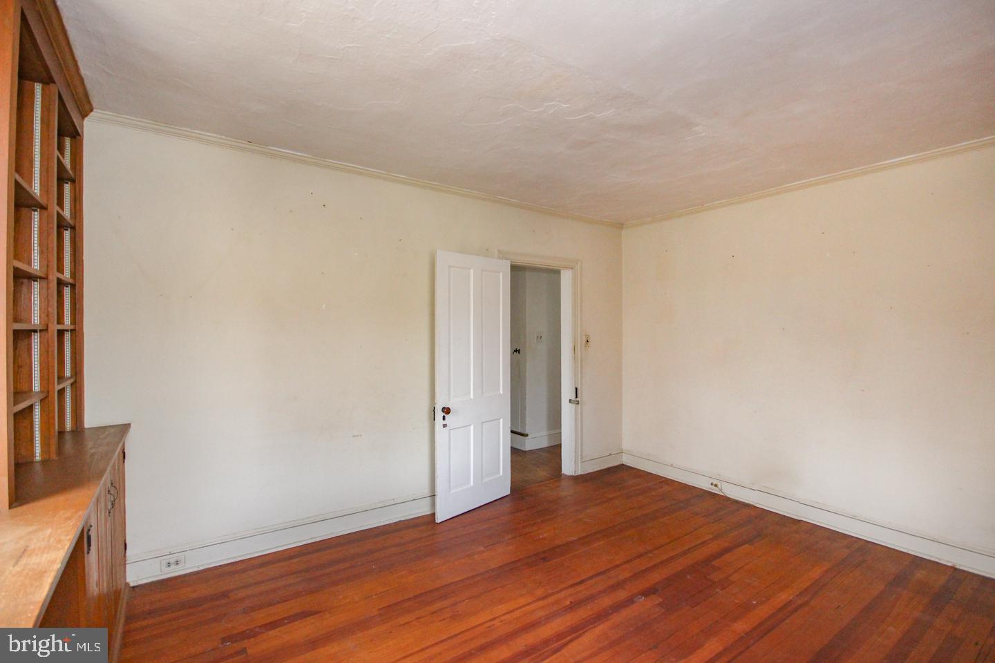 432 Old Forge Road Media, PA 19063 - Photo 22 of 41 a view of an empty room with wooden floor and a window