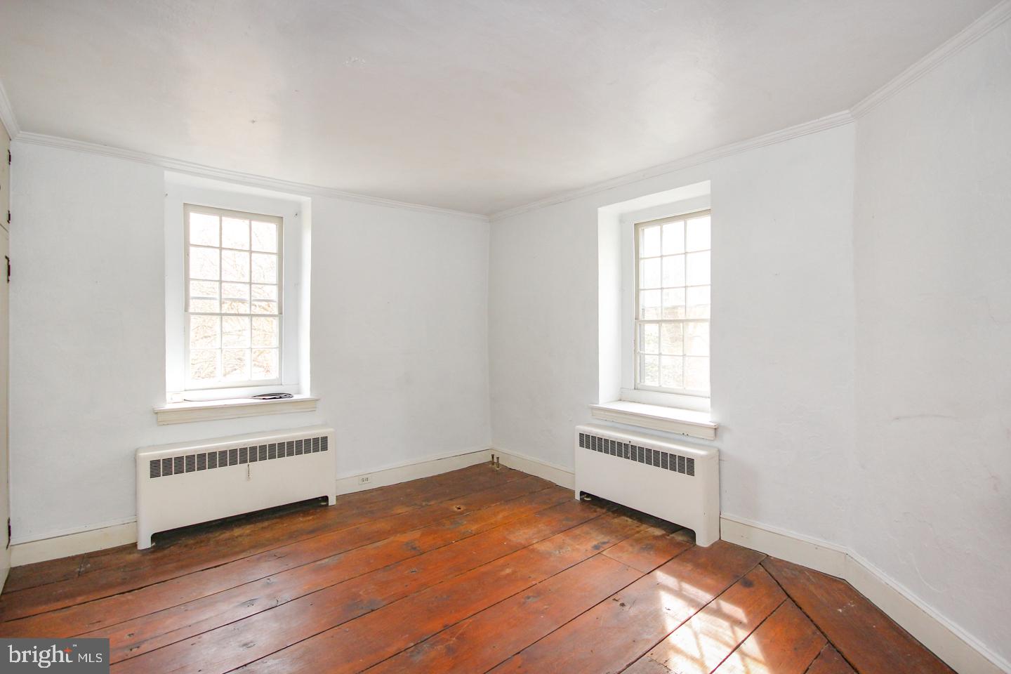 432 Old Forge Road Media, PA 19063 - Photo 24 of 41 an empty room with wooden floor and windows