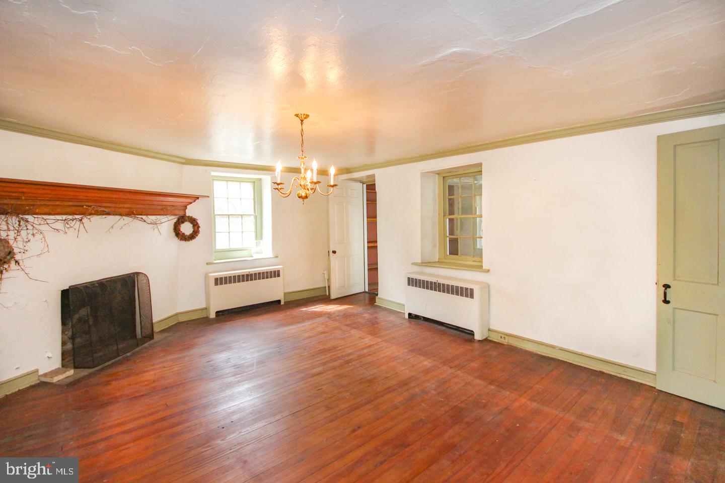 432 Old Forge Road Media, PA 19063 - Photo 9 of 41 a view of a livingroom with wooden floor and fireplace