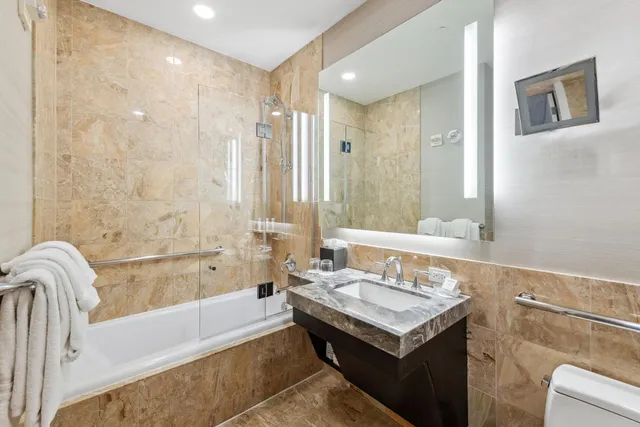 a living room with a flat screen tv and a couch