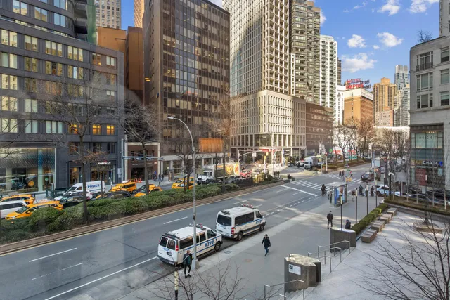 a bathroom with a tub a sink and a mirror