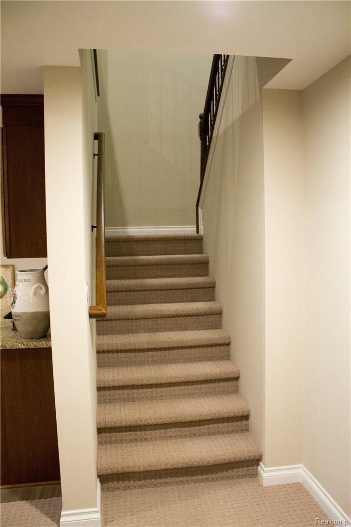 1901 Fiddler Court, Unit 7 Howell, MI 48843 - Photo 54 of 77 Going downstairs
