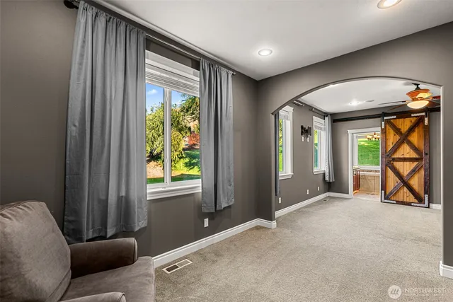 a living room with furniture and a window