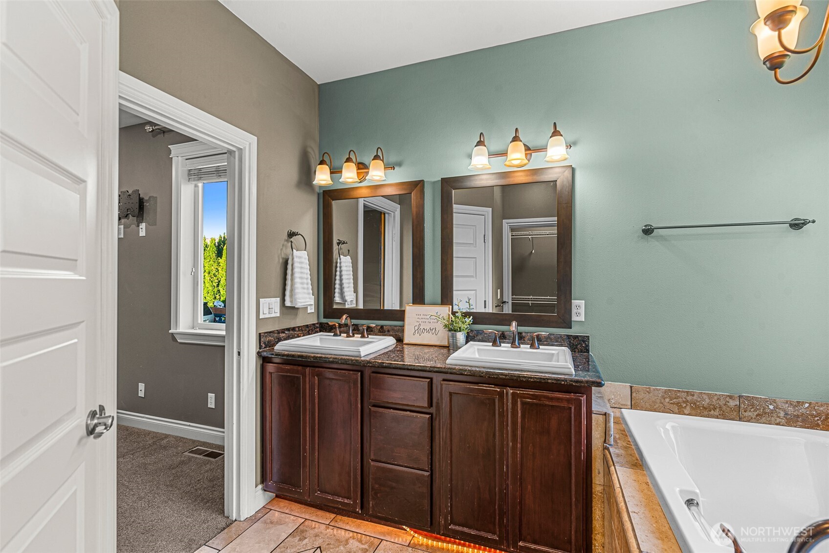 2945 Martin Place East Wenatchee, WA 98802 - Photo 20 of 40 a bathroom with a sink and a mirror