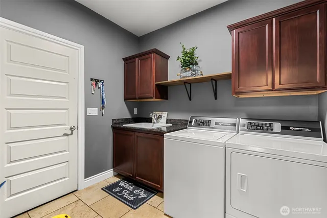 a view of storage and utility room with washer and dryer