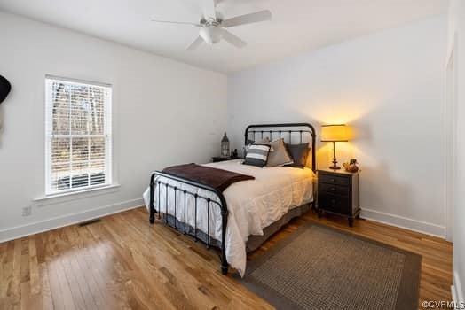 16501 River Road Chesterfield, VA 23838 - Photo 15 of 49 a bedroom with a bed and wooden floor