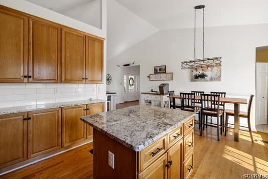 16501 River Road Chesterfield, VA 23838 - Photo 20 of 49 a kitchen with a kitchen island sink stove and wooden floor