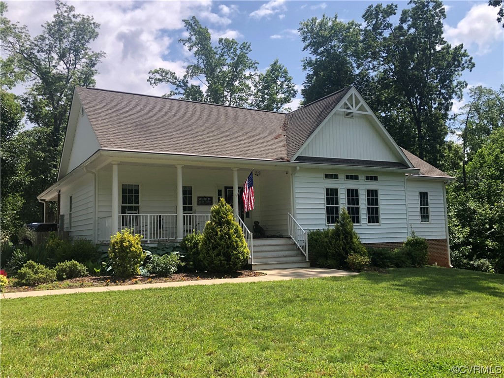 16501 River Road Chesterfield, VA 23838 - Photo 3 of 49 a front view of a house with a yard and potted plants
