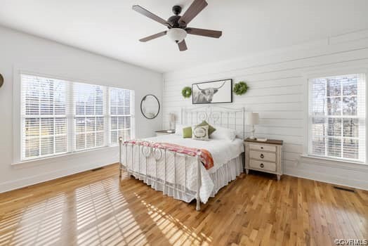 16501 River Road Chesterfield, VA 23838 - Photo 10 of 49 a bedroom with a bed and a large window with wooden floor