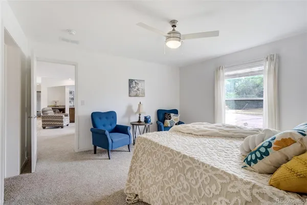a bedroom with a bed furniture and a window