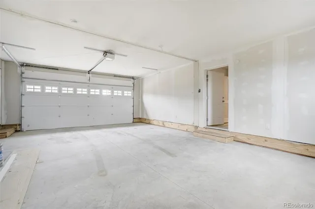 a house with white door of side of it