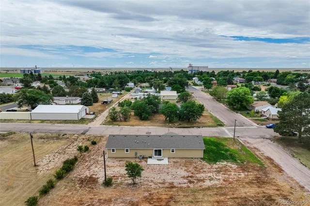 an aerial view of a city and ocean view
