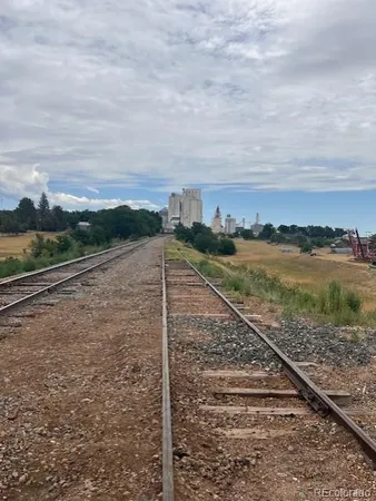 a view of residential houses with a street