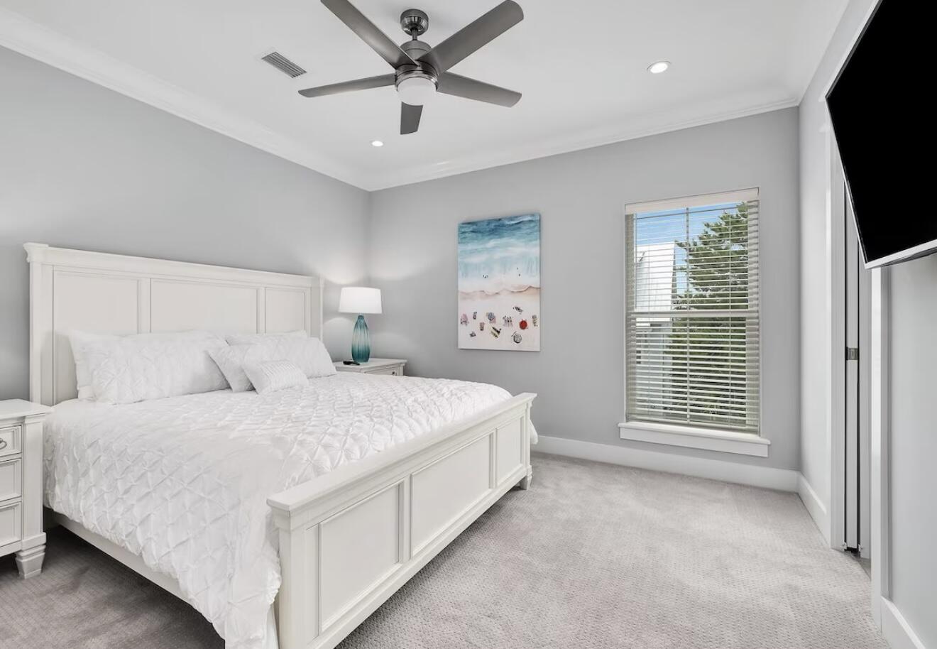 37 Grande Pointe Drive Inlet Beach, FL 32461 - Photo 29 of 58 a spacious bedroom with a bed and a flat screen tv
