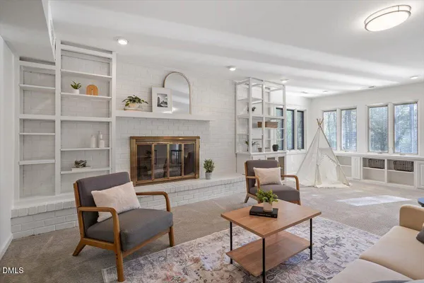 a living room with furniture and a fireplace