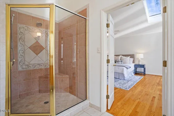 a bathroom with a shower and a sink