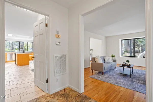 a living room with furniture and a table
