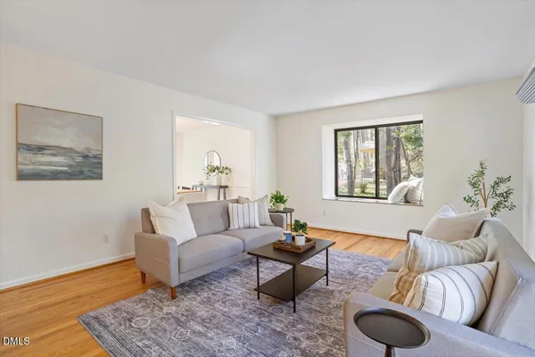 a living room with furniture and a rug