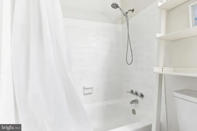 a bathroom with a bath tub
