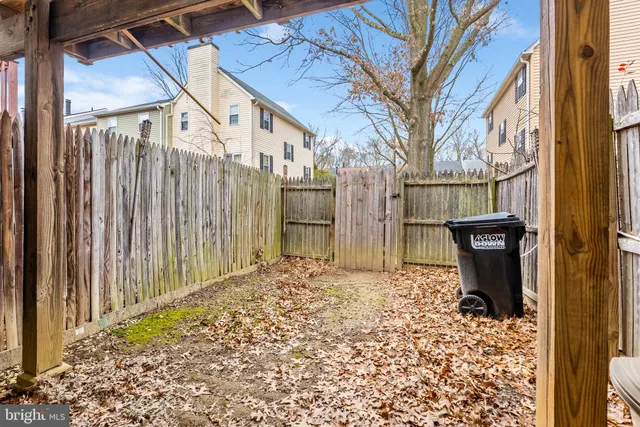 a sign board with a small yard