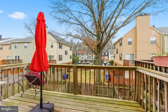 a view of a small deck with a backyard