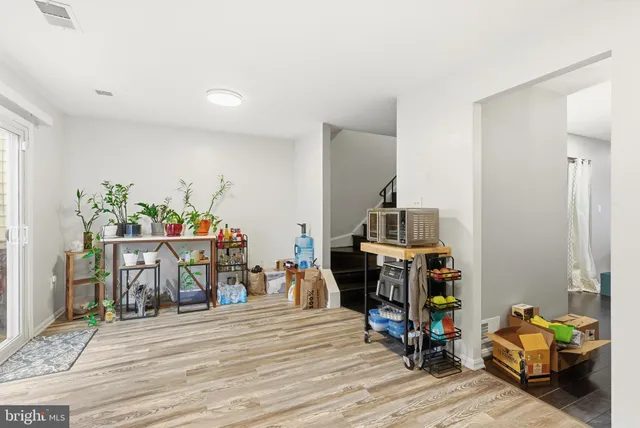 a room with furniture and wooden floor