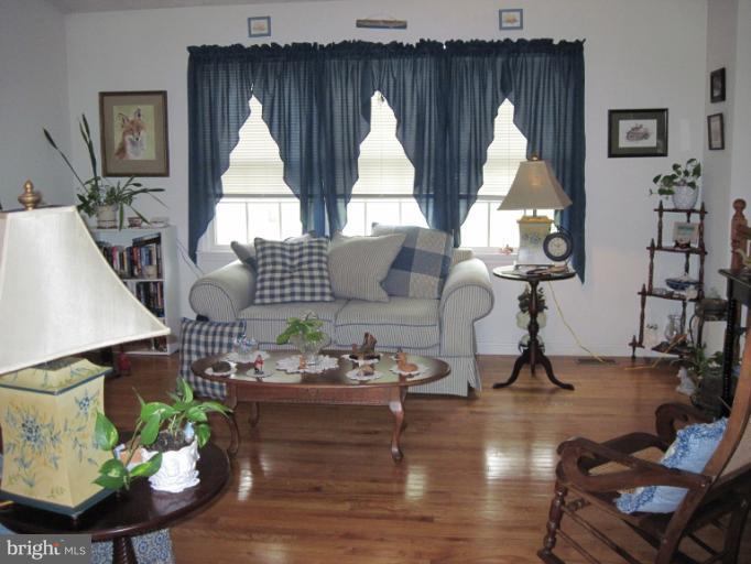 9269 Mountjoy Road Marshall, VA 20115 - Photo 1 of 14 a living room with furniture a window and wooden floor