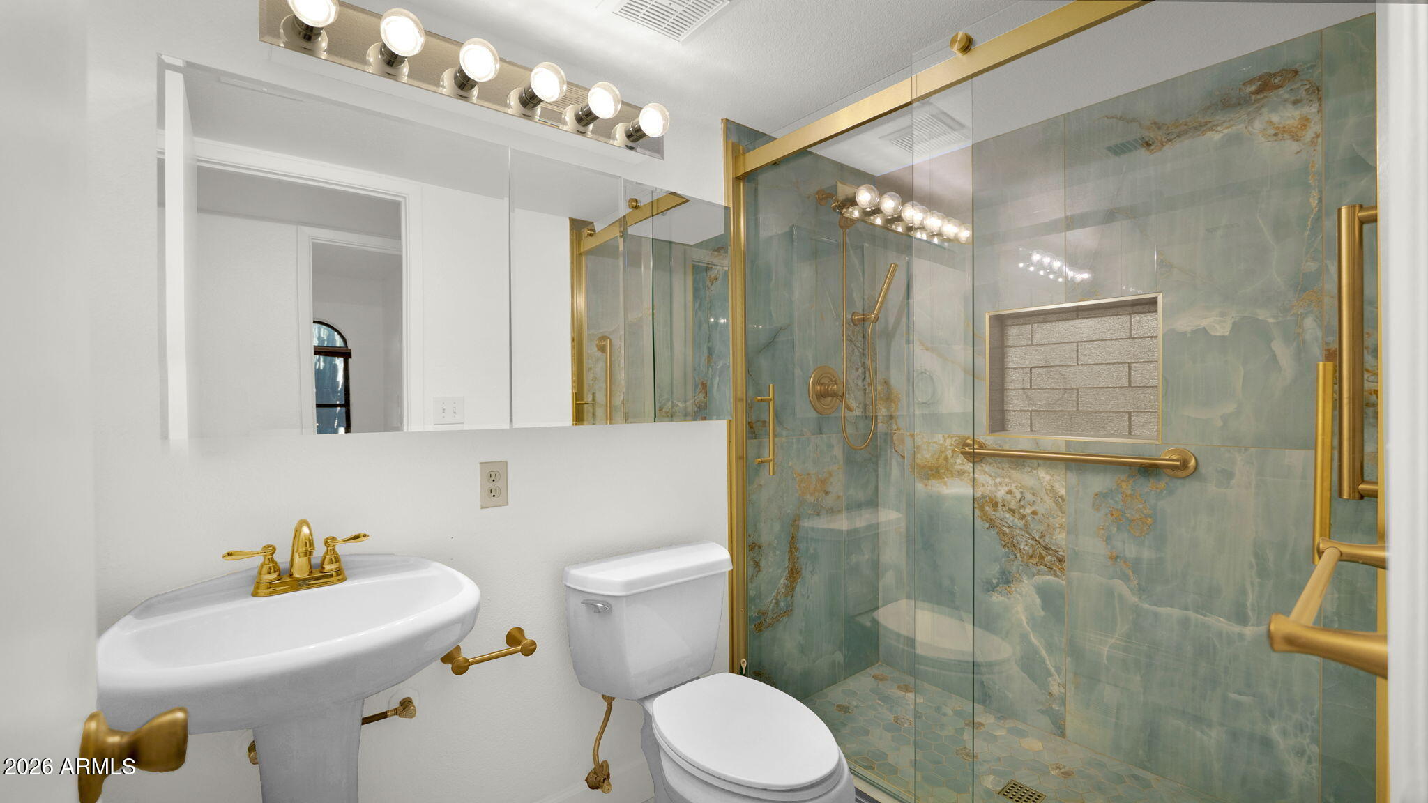 15625 North 20th Street Phoenix, AZ 85022 - Photo 11 of 25 a bathroom with a sink toilet a mirror and shower