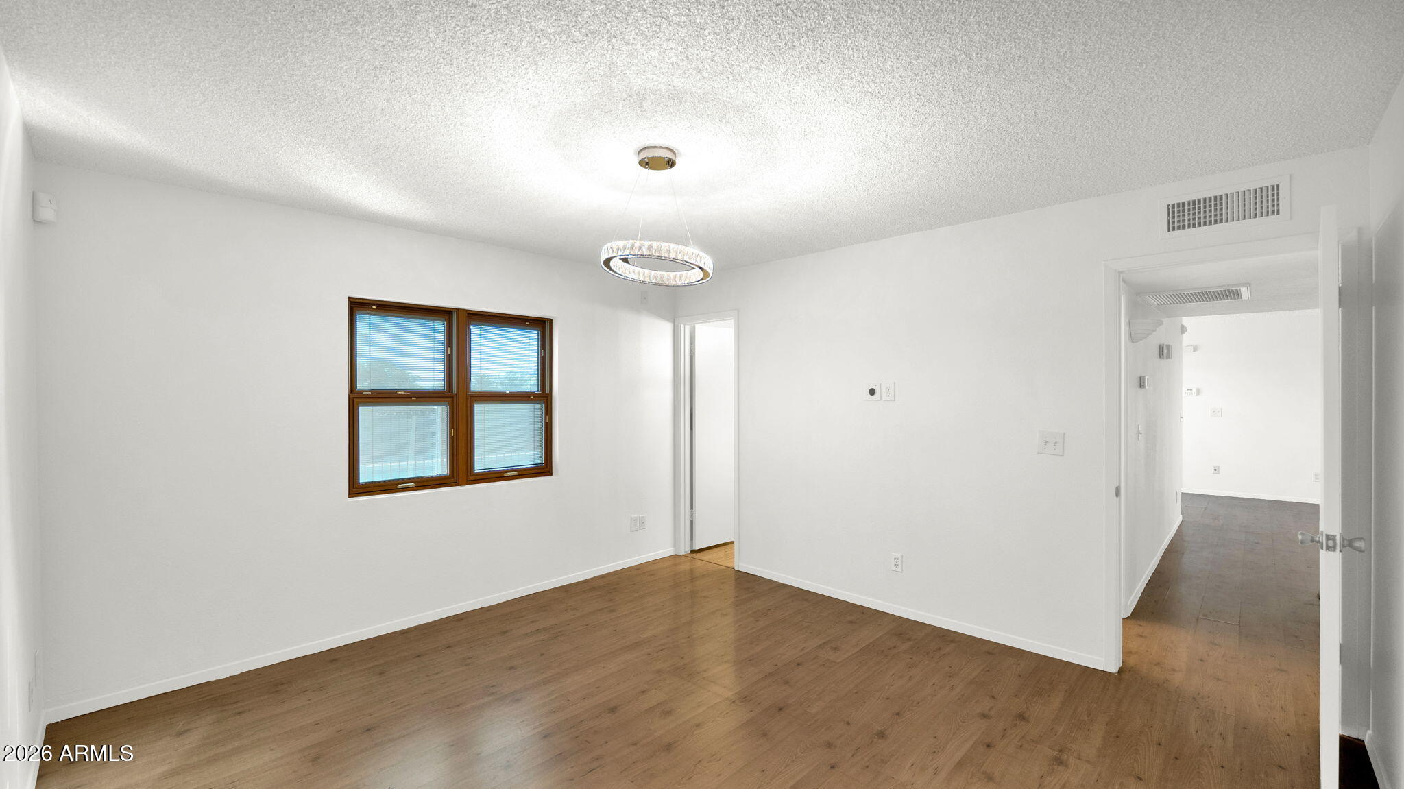 15625 North 20th Street Phoenix, AZ 85022 - Photo 20 of 25 an empty room with windows and closet