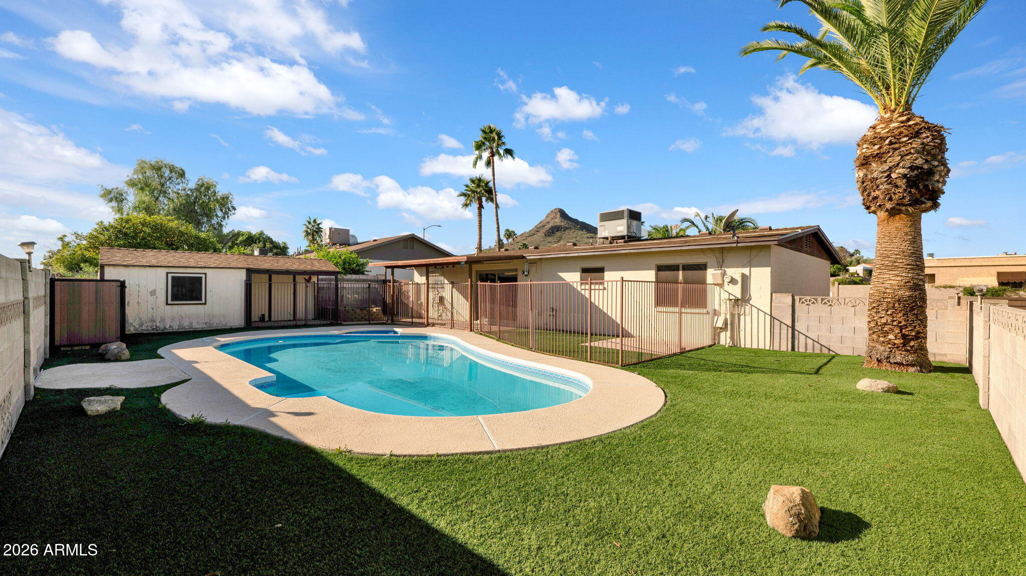 15625 North 20th Street Phoenix, AZ 85022 - Photo 3 of 25 a front view of a house with garden