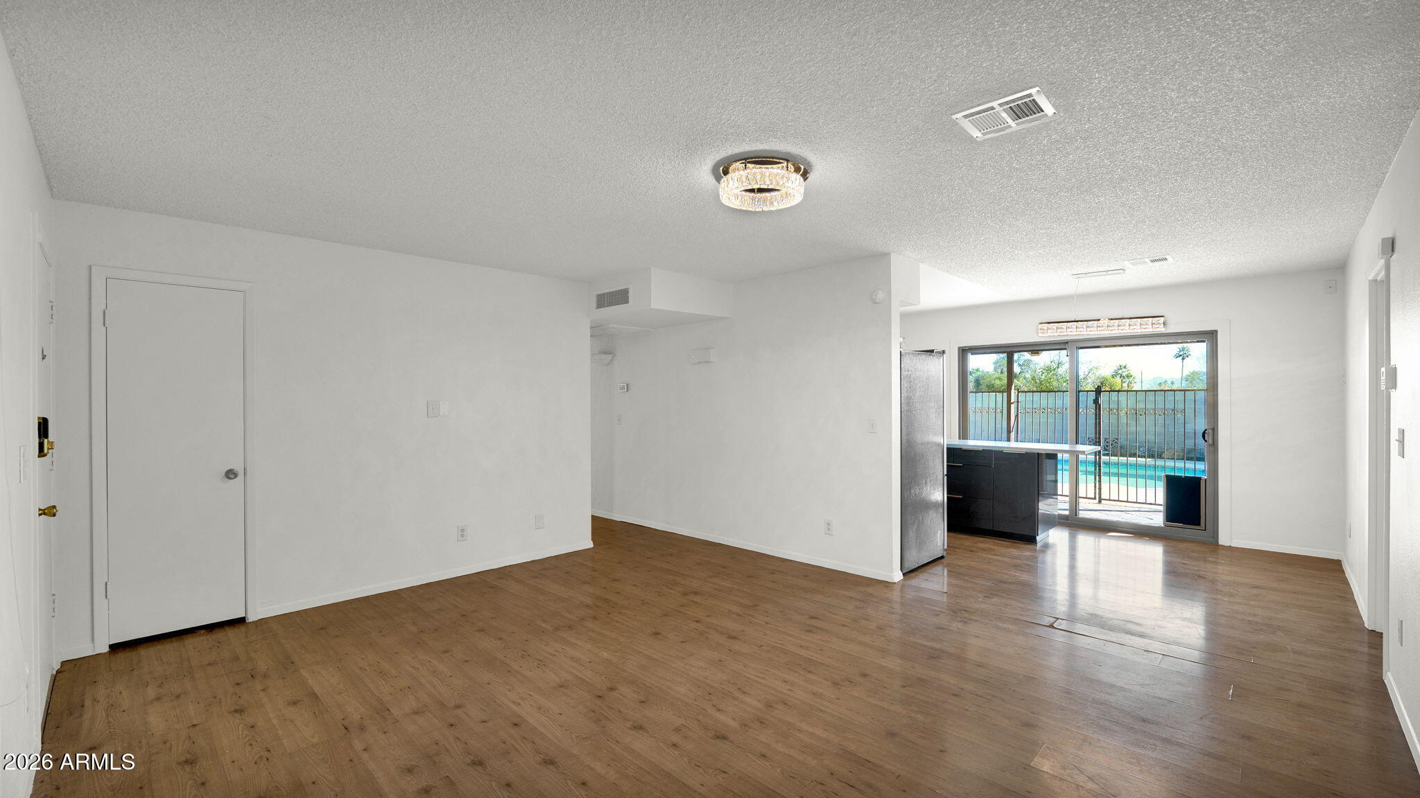 15625 North 20th Street Phoenix, AZ 85022 - Photo 25 of 25 a view of an empty room with wooden floor and a window