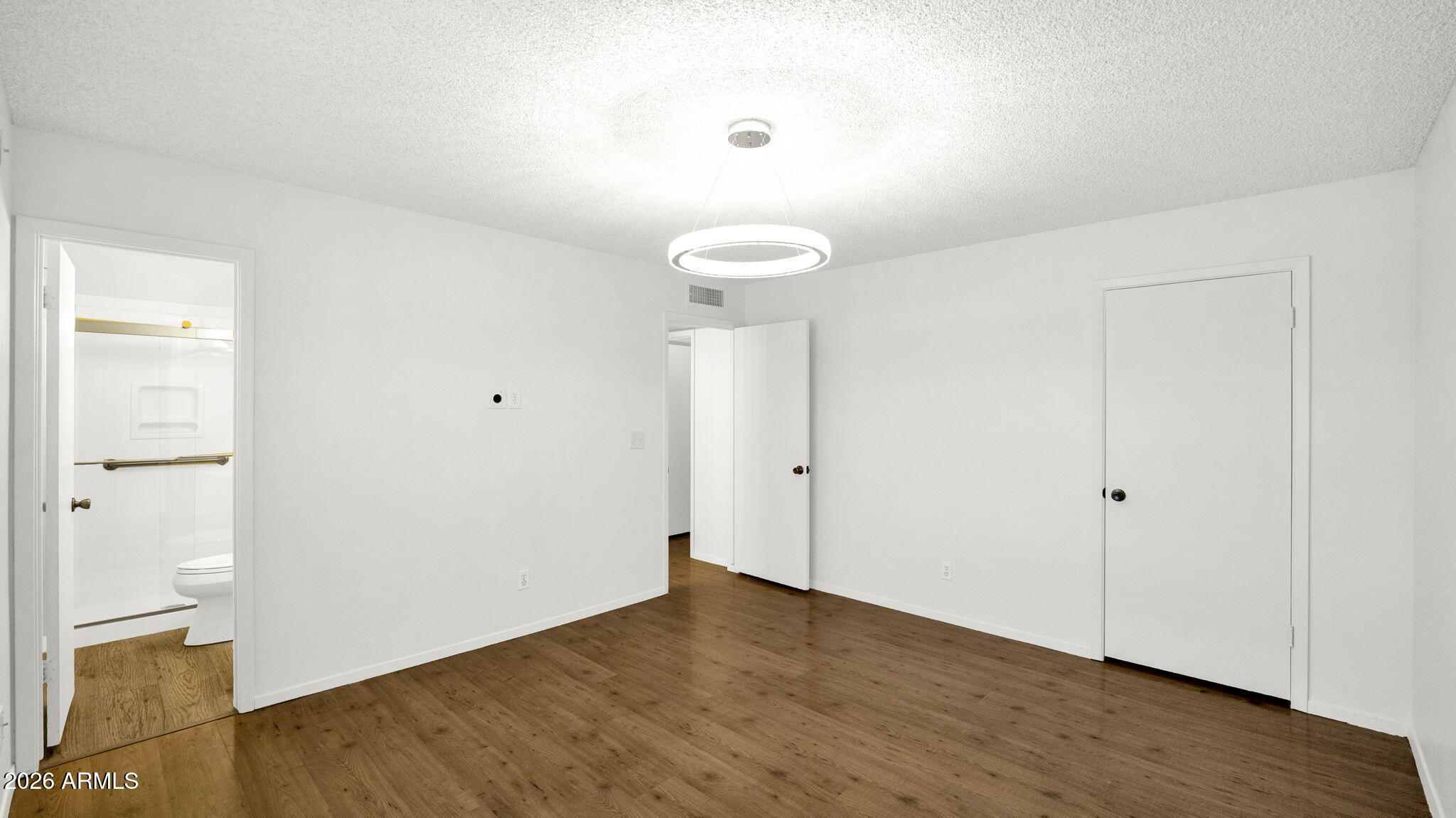 15625 North 20th Street Phoenix, AZ 85022 - Photo 7 of 25 a view of a room with wooden floor