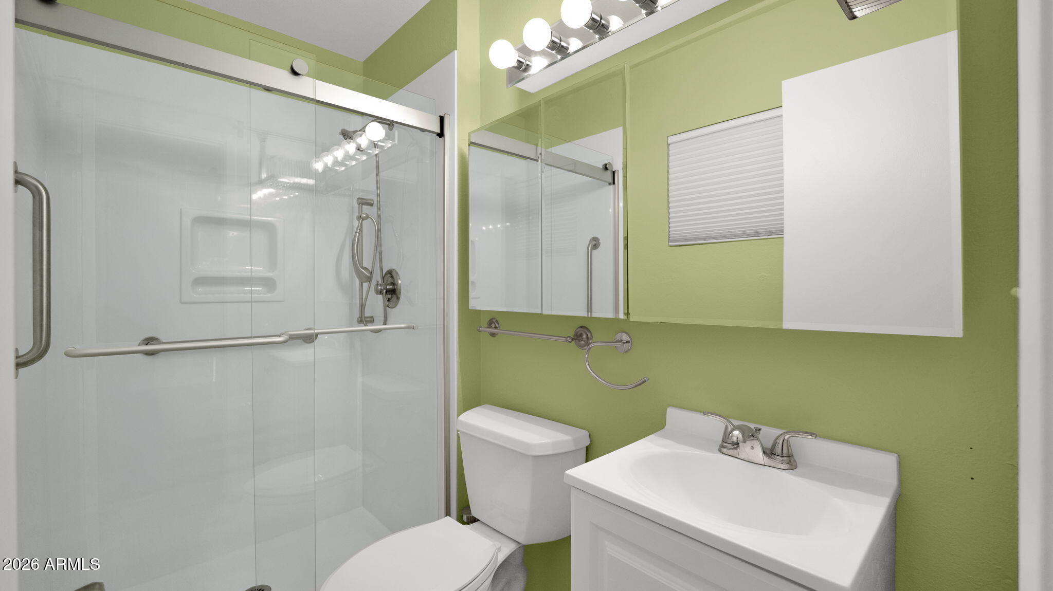 15625 North 20th Street Phoenix, AZ 85022 - Photo 8 of 25 a bathroom with a toilet sink and shower