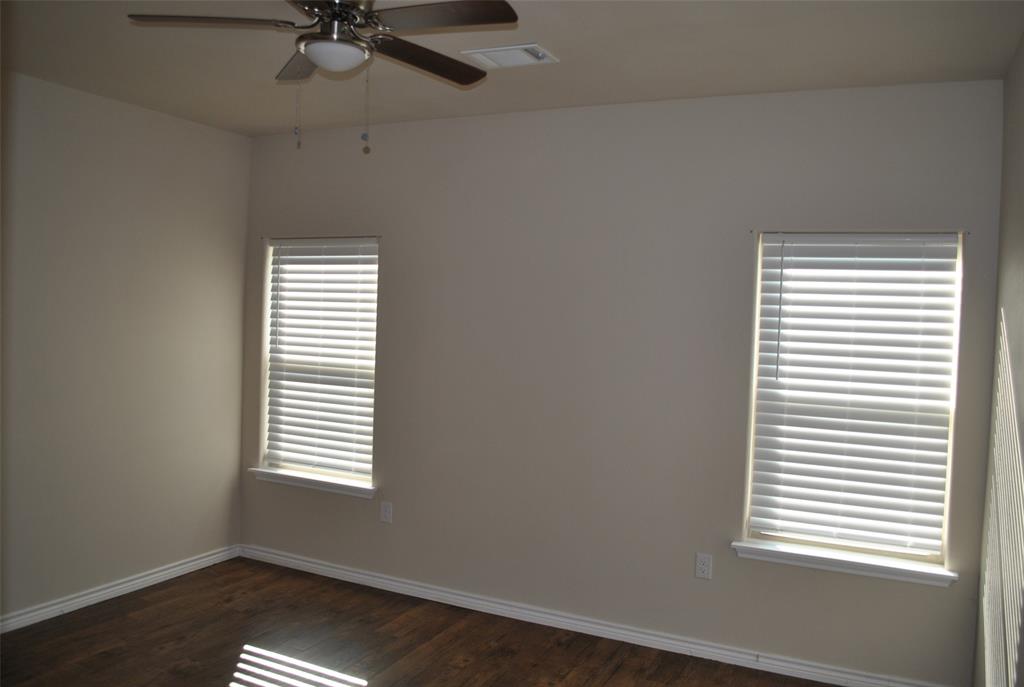412 Dewitt Street Collinsville, TX 76233 - Photo 12 of 17 an empty room with a window