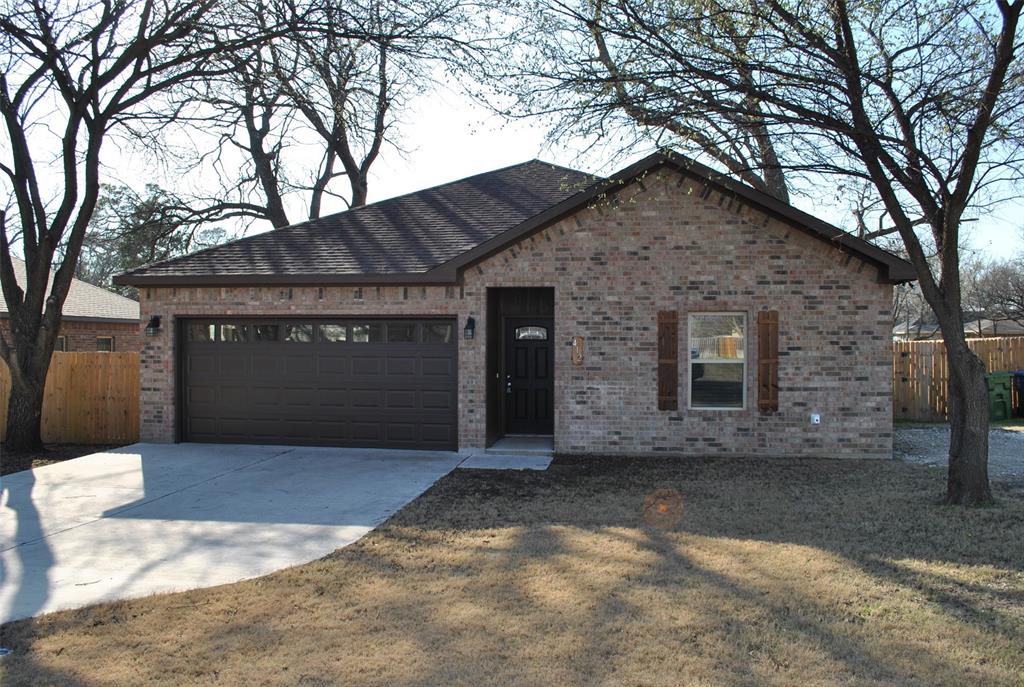 412 Dewitt Street Collinsville, TX 76233 - Photo 17 of 17 a front view of a house with yard and trees