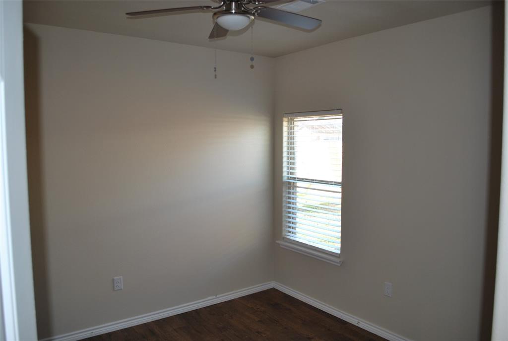412 Dewitt Street Collinsville, TX 76233 - Photo 8 of 17 an empty room with a window