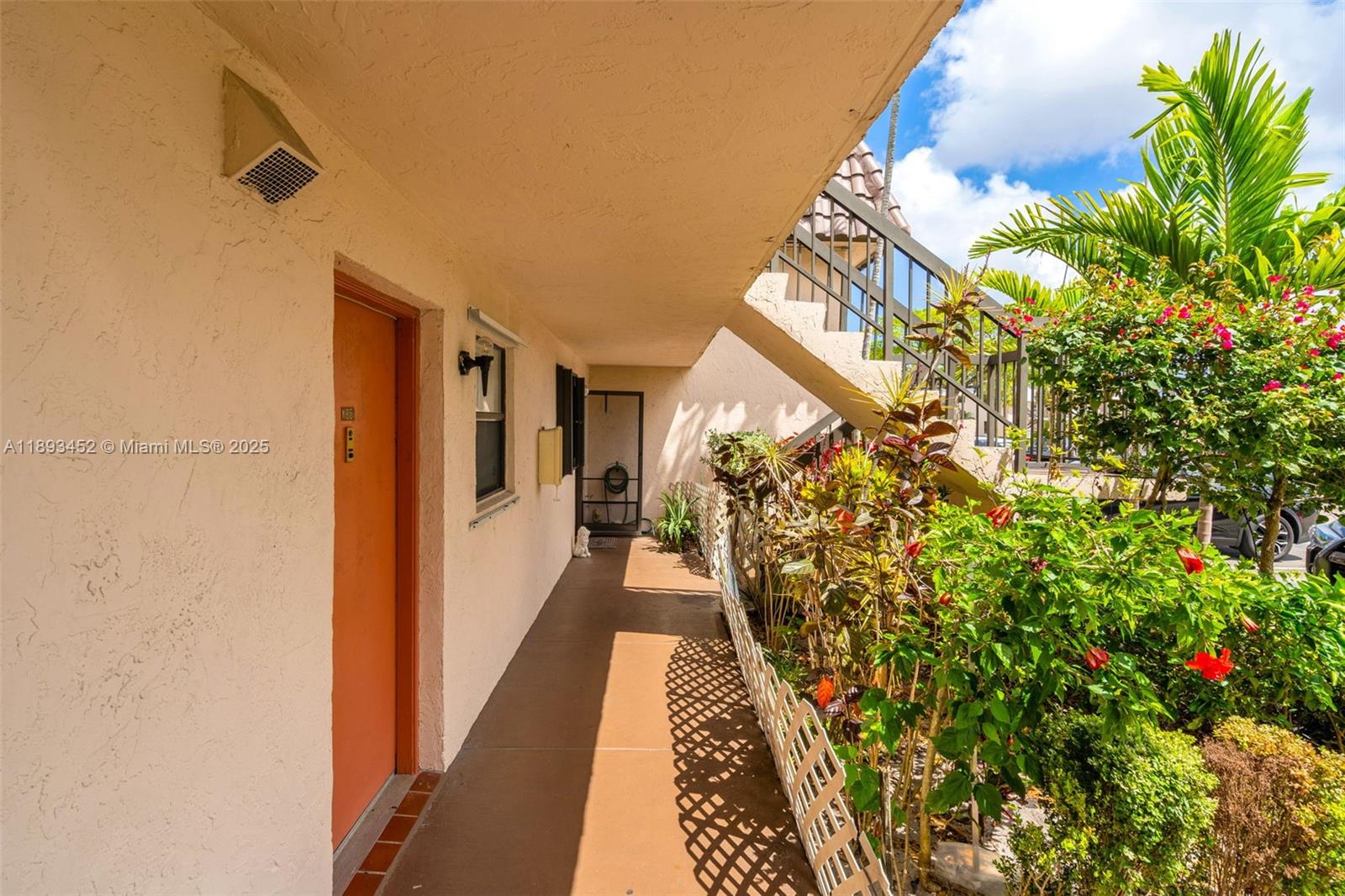 821 Northeast 207th Lane, Unit 1105 Miami, FL 33179 - Photo 1 of 12 a view of entryway with flower pots